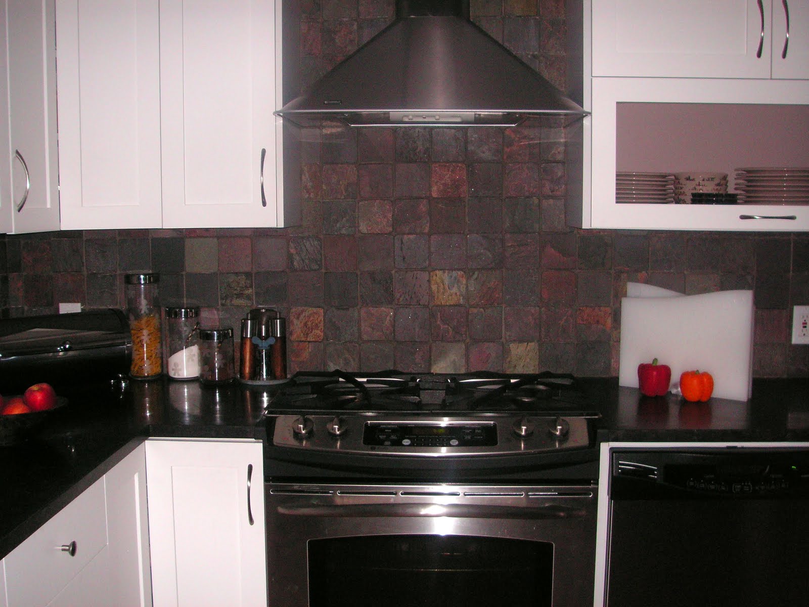 The white cold color cabinets were offset by the use of the warm stone The white cold color cabinets were offset by the use of the warm stone