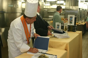 Signing the cookbooks -- $28 -- $28 -- $28... Signing the cookbooks -- $28 -- $28 -- $28...