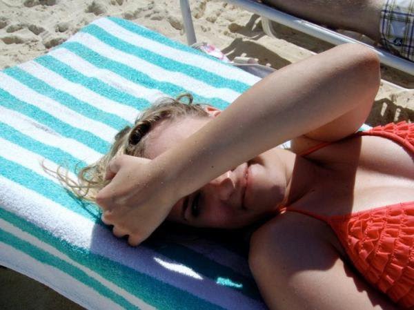 Emily Osment cleavage and bikini