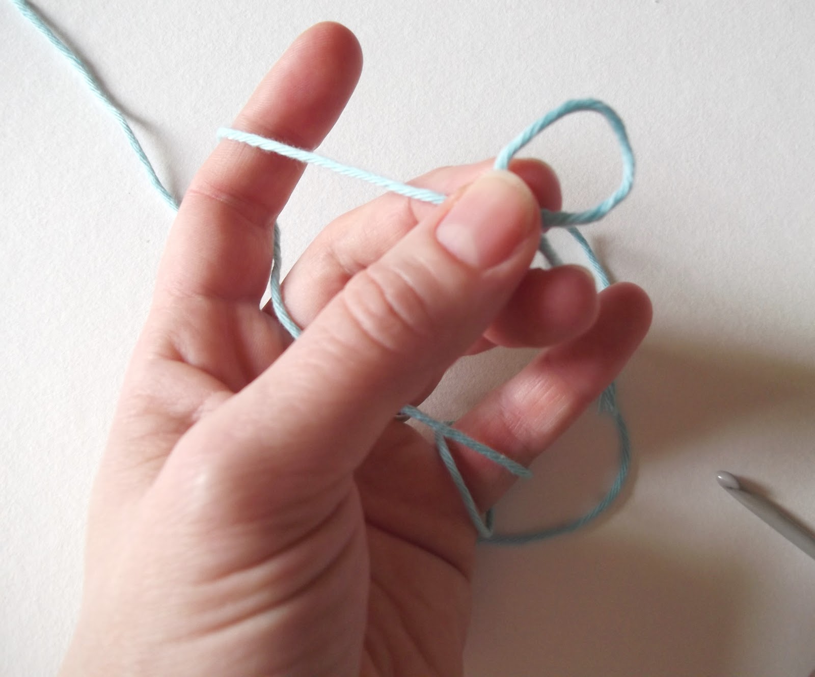 ... your fingers, then take hold of the loop between your thumb and middle