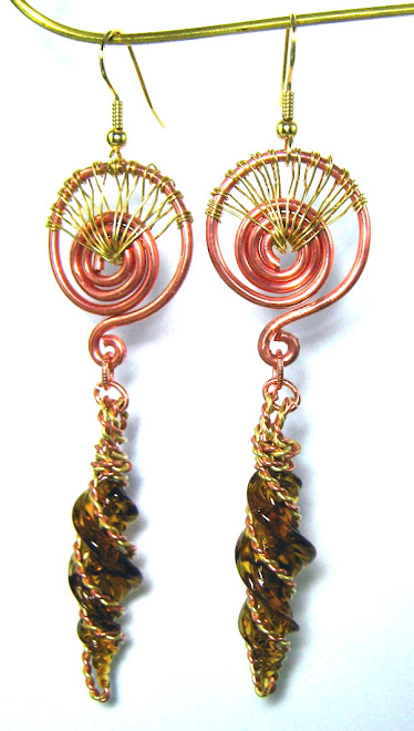 NATURAL COPPER AND BRASS WIRE WRAPPED AND WOVEN GLASS SWIRLS     $45.00   SOLD