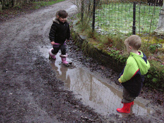 Playing in a puddle with Amirah
