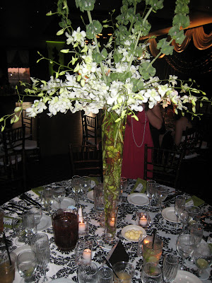 Beautiful Tall Centerpieces with white Orchids and bells of Ireland Beautiful Tall Centerpieces with white Orchids and bells of Ireland