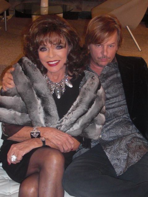 One hour ago Joan Collins tweeted this picture of her and David Spade on 