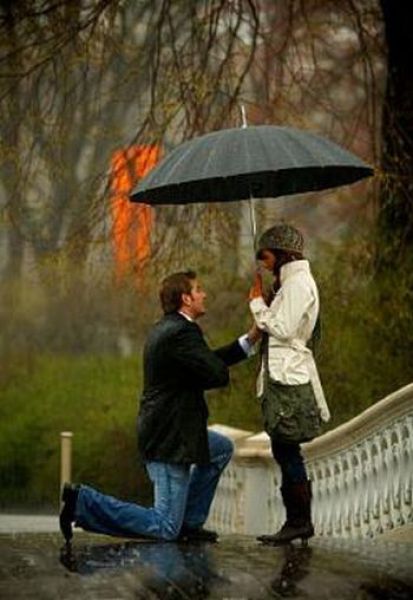 couple kissing in the rain. romantic couple kissing in the