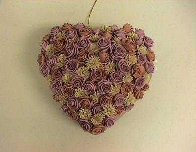 This paper made heart with beautiful folded roses and fringed flowers