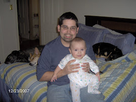 a man, a baby, and 3 lazy dogs