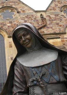 its a nun... made of bronze... i have no idea why i took it... and although i didn't take it today (too wet), i did go past her on my way to the market its a nun... made of bronze... i have no idea why i took it... and although i didn't take it today (too wet), i did go past her on my way to the market