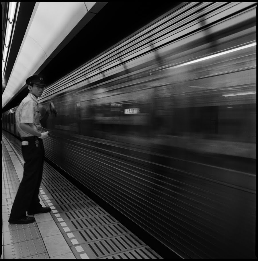 [train-man-with-rushing-train.jpg]