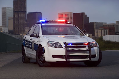 GM equipped Chevrolet Caprise under police car