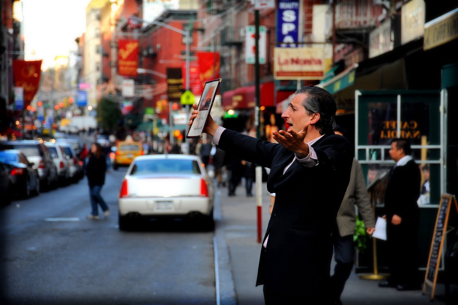 It's commonplace for Italians in Little Italy, NYC to stand on the