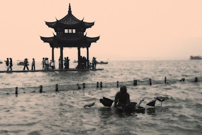 ... of a pier with a Chinese pa...