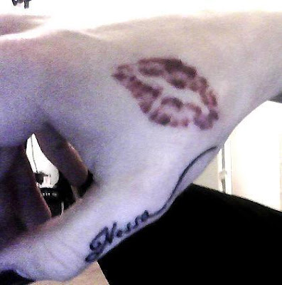 kiss mark tattoo