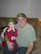 Ryan and grandpa in PJs and new matching hats