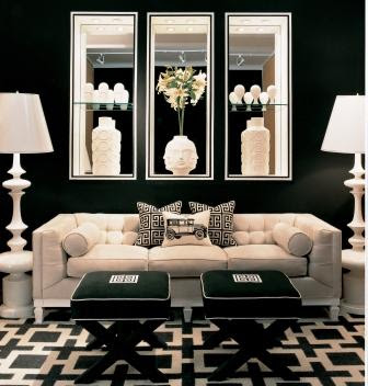 black and white living room black walls x benches black mirrors behind sofa black and white geometric rug in living room