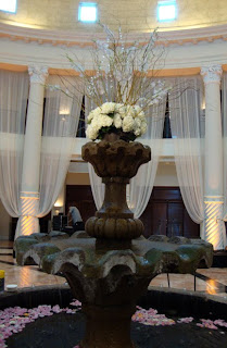 Rose petals and Gerbera Daisies floating in the fountain Rose petals and Gerbera Daisies floating in fountain water