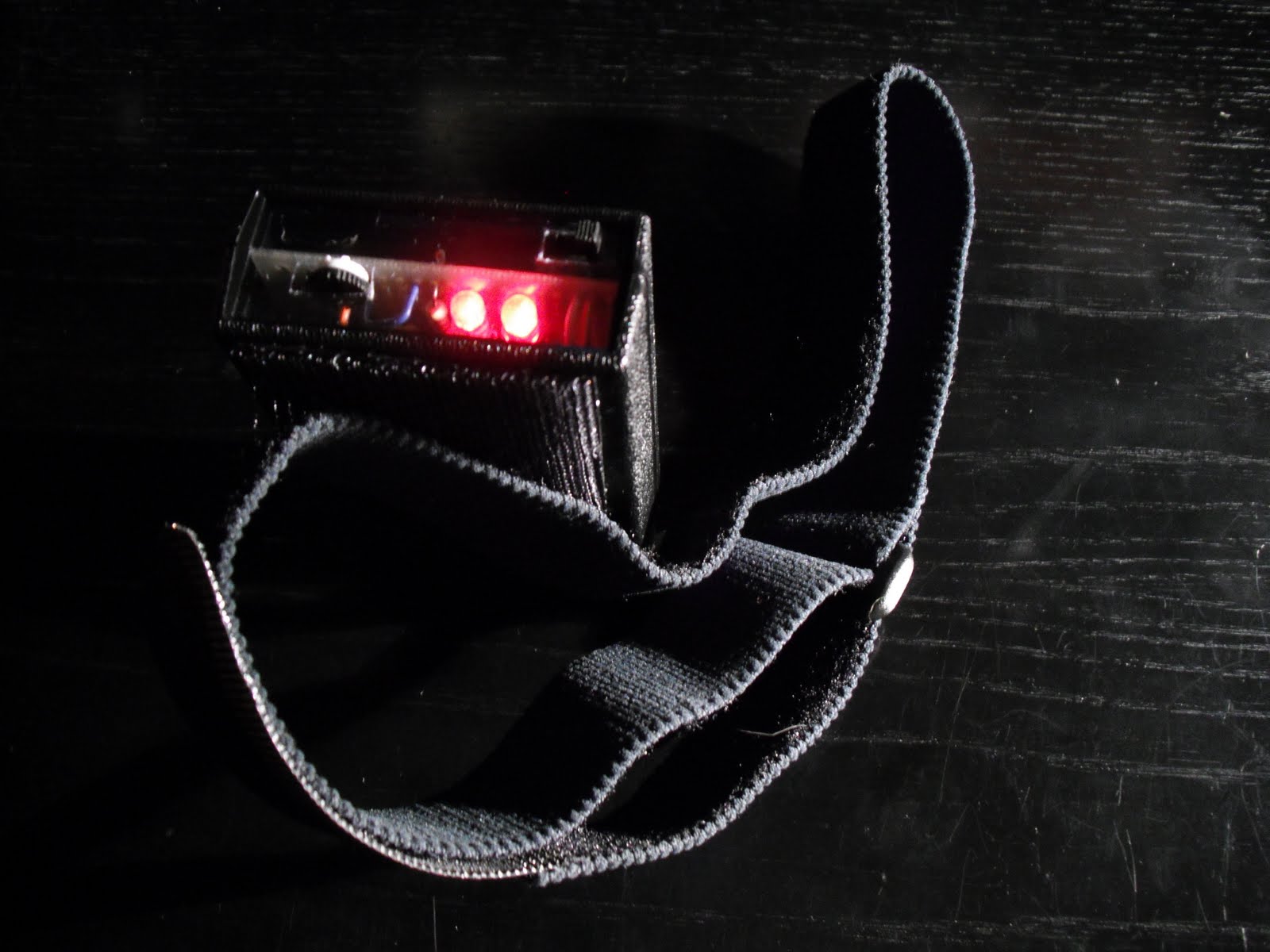 deep red flashlight with head strap