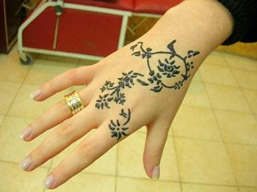 pretty hand tattoo flower style