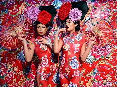Two Chinese Model In Red Colour For Body Painting Art