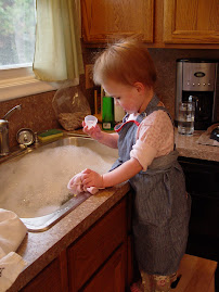 helping mommy wash bottles