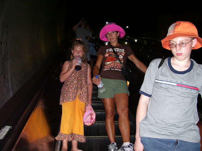 orange and brown capri set with mom & Connor in Washington DC in Metro station