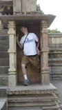 Kevin posing like the figures carved into the temples.