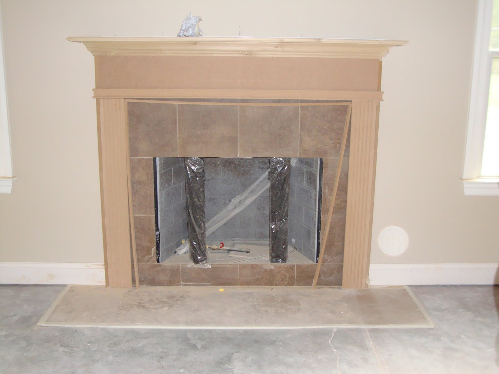 Home Building Project Backsplash, Front Door, Mantle, and Furniture