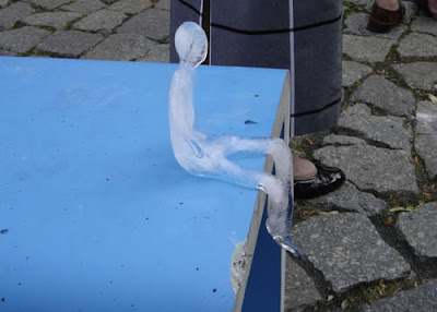 Ice Sculptures of Melting Men