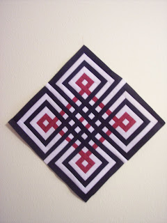 Black, White and Red Fabric made into a Quilt Block
