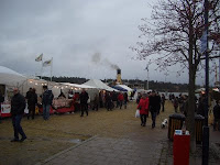 Christmas market in Nynäshamn harbour, S/S Blidösund in background