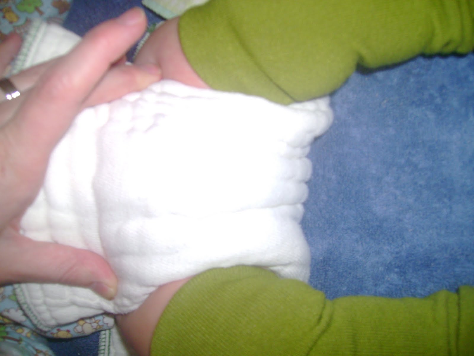 Leaving Little Footprints Folding a prefold diaper Jelly Roll Fold