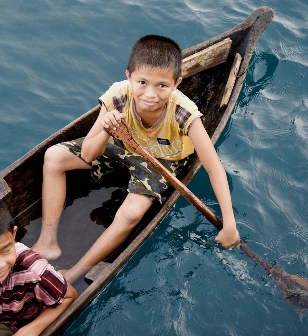 Boy In Canoe