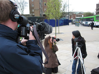 Jennie being besieged by the local press