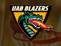 triangle UAB logo with a long necked green dragon spitting fire. The background is an out of focus basketball going through a netted hoop.