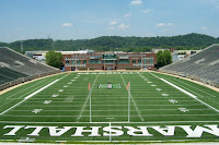 View from the end zone of an empty Marshall University football stadium.