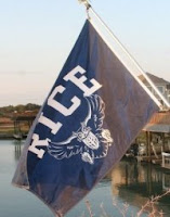 Rice flag with owl flying over water.