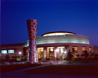 Lit up building on Houston campus at night.