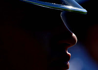 Air Force darkened face with shining black hat.