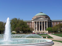 Water fountain in front of domed colonial style building on the SMU campus.