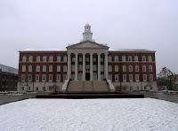 Colonial style building on the Southern Methodist University campus with snow on the ground in front of the building.