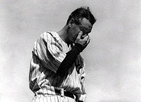 New York Yankees first baseman Lou Gehrig wipes away a tear during a sold-out tribute at Yankee Stadium on July 4, 1939. (AP Photo/Murray Becker)