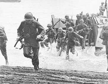 U.S. Marines charge ashore on Guadalcanal Island from a landing barge in August 1942. (AP Photo)