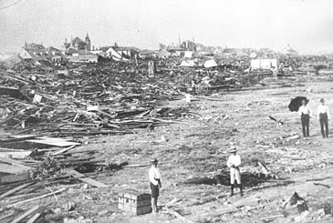 People stand amid the ruins in Galveston, Texas, after a hurricane hit on Sept. 8, 1900. (AP Photo)
