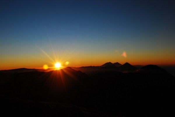 [3553399-Sun-rise-over-the-horizon--just-in-time-to-met-the-sun-who-was-about-to-clear-the-horizon-view-from-Santa-Maria-volcano-1.jpg]