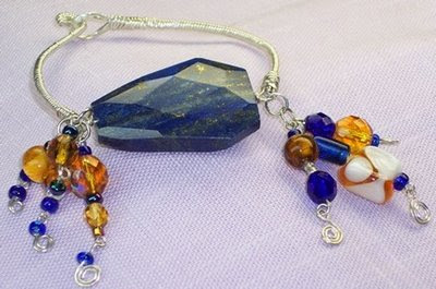 Wire Wrapped 28mm x 40mm Faceted Lapis bracelet by Jannadu shop on etsy