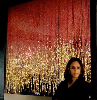 Sreeti Mondal with beaded curtains