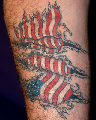 Popular American Flag and Cross Tattoo Design on Arm for 2011