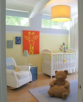 A classic nursery with pale yellow walls colorful animal themed art 