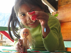 Showing her dolls in a restaurant in Cocha