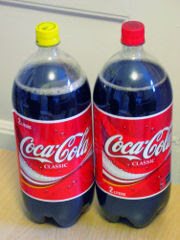 Passover Coke with sugar (yellow cap), high fructose corn syrup Coke (red cap)